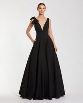 Black Sleeveless Plunge Neck Ball Gown With Bow Detail